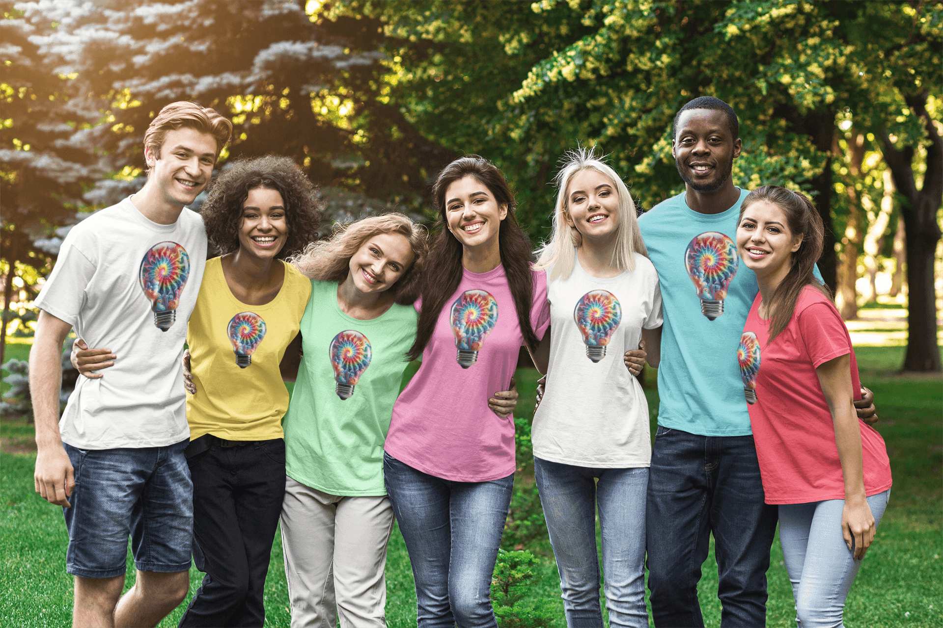 Group of smiling friends outdoors wearing t-shirts with colorful lightbulb designs.